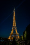 Eiffel Tower at night from Champ du Mars park in Paris