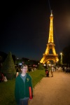 Kyle and Eiffel Tower at night from Champ du Mars park in Paris