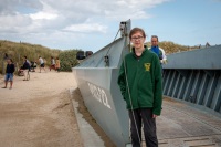 Kyle with Higgins boat at Utah Beach in Normandy