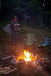 Kyle with campfire at our cabin in Long Lake, NY