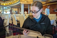 Kyle in the Main Dining Room on Voyager of the Seas in the Baltic Sea