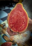 Tasting fruit at Paloquemao market in Bogota