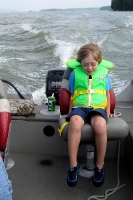 Kyle enjoying a ride in Grandpa\'s boat