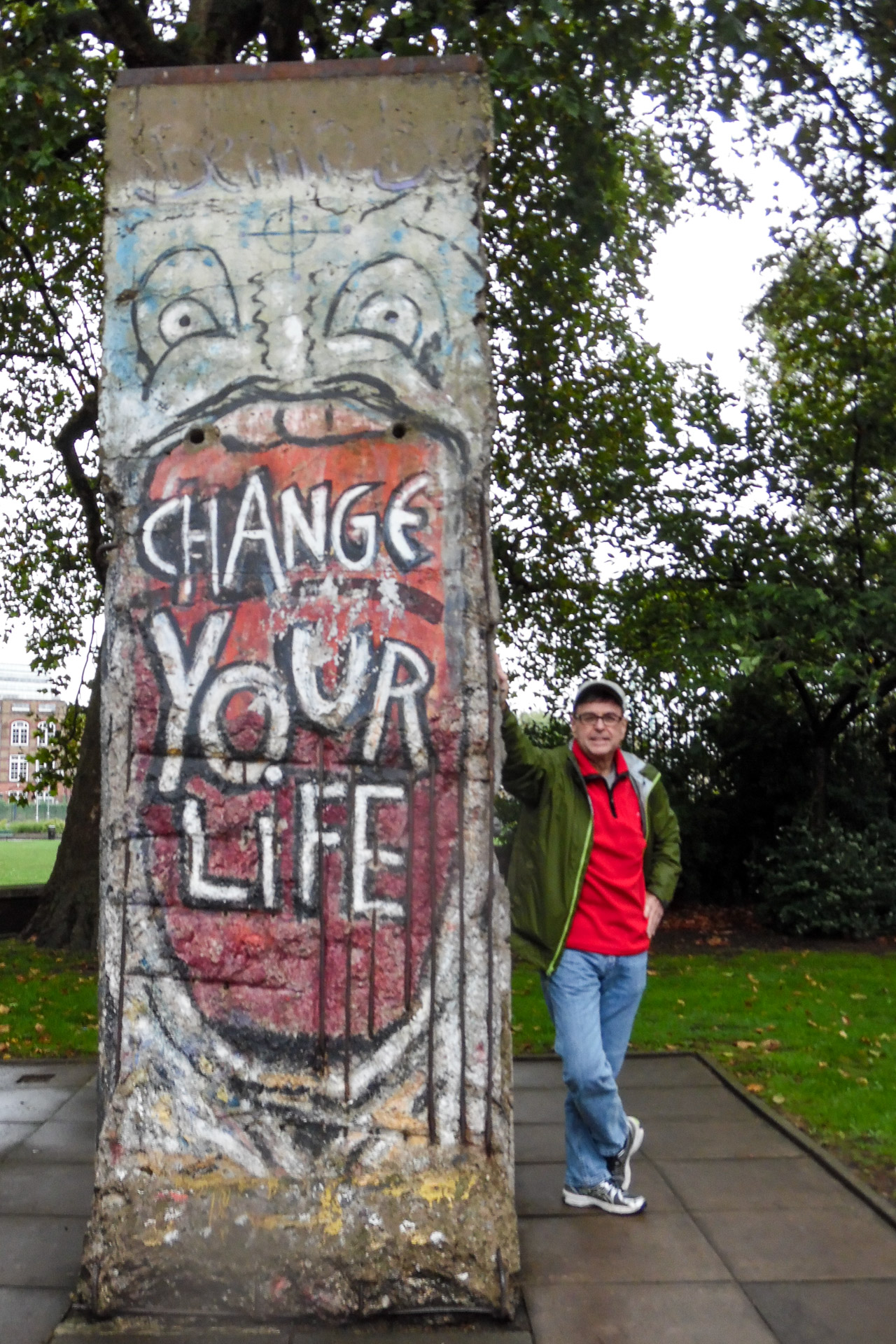 Peter and piece of Berlin Wall at the Imperial War Museum in London