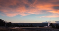 Sunset and Old Faithful Geyser in Yellowstone