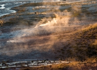 Sunrise at Old Faithful Geyser in Yellowstone