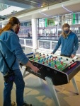 Paul and Kyle playing foosball on Anthem of the Seas in Bayonne