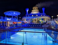 Pool deck at night on Anthem of the Seas