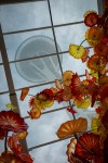 Glasshouse and Glasshouse Sculpture with Space Needle at Chihuly Garden and Glass Museum in Seattle