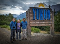 Kyle, Suzanne and Paul at Welcome to Yukon sign