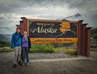 Pul and Suzanne at Welcome to Alaska sign