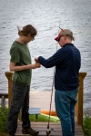 Ken helping Kyle fish at Lucys camp on Burns Pond in Whitefield NH