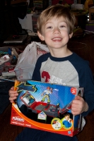 Kyle opening his Firetruck Santa Present