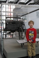 Munich Deutsches Museum Transport Center: Kyle with the first gasoline powered car.