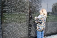 Taking a name rubbing at the Vietnam Veterens Memorial