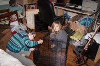 Kyle and Suzanne assembling the rat cage at our house in Fanwood