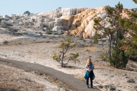 Kyle with Cleopatra Terrace at Mammoth Hot Springs in Yellowstone
