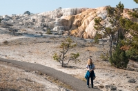 Kyle with Cleopatra Terrace at Mammoth Hot Springs in Yellowstone